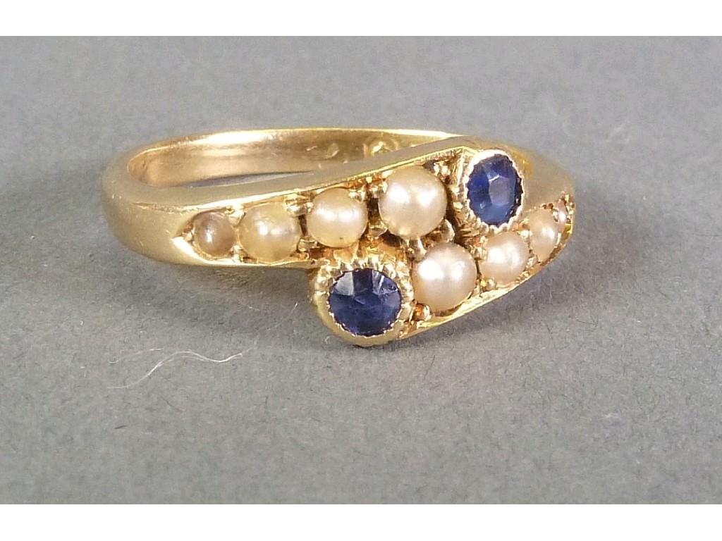 Appraisal: EDWARDIAN ct GOLD CROSSOVER RING collet set with two sapphires