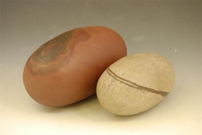 Appraisal: Two Indian Shiva Lingam stones in cm and in cm