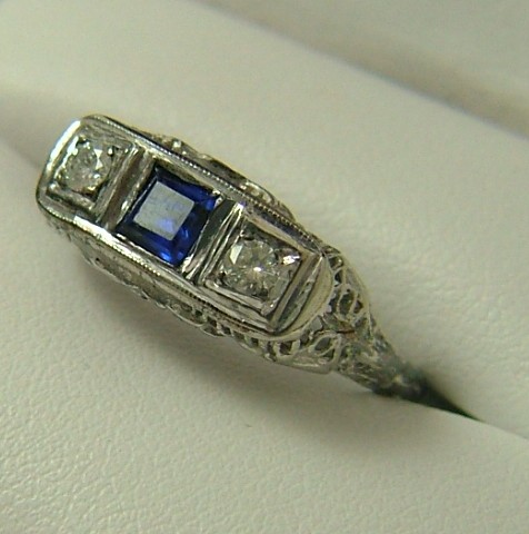 Appraisal: SAPPHIRE DIAMOND AND TEN KARAT WHITE GOLD RING centering a