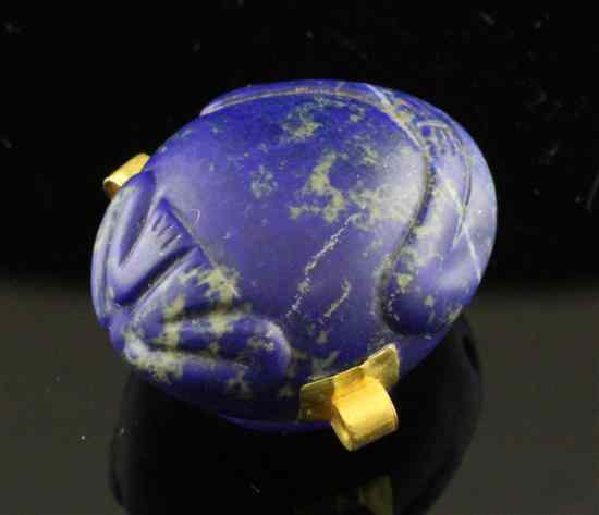 Appraisal: An Egyptian lapis lazuli ointment pot with gold mounts cast