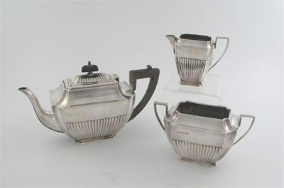 Appraisal: A Victorian three-piece teaset oblong with canted corners part fluting