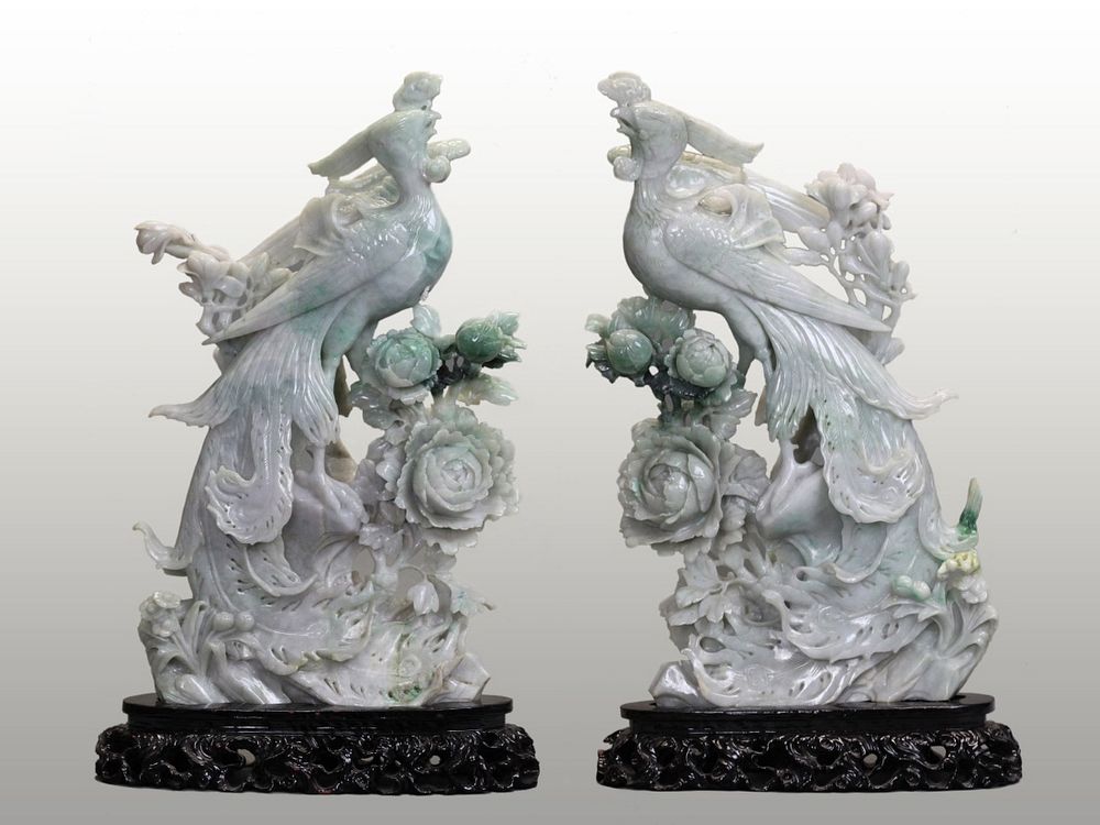 Appraisal: pair of Chinese jadeite phoenixes jadeite with apple green tones