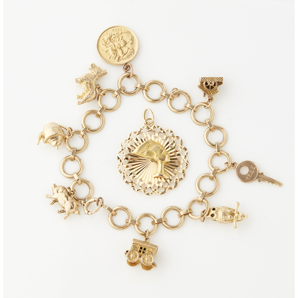 Appraisal: A ct gold charm bracelet composed of circular links suspending