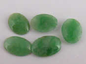 Appraisal: Five loose polished jade cabochons largest approx x mm appprox