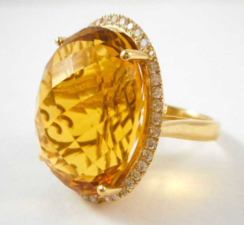 Appraisal: CITRINE DIAMOND AND FOURTEEN KARAT GOLD RING with round-cut diamonds