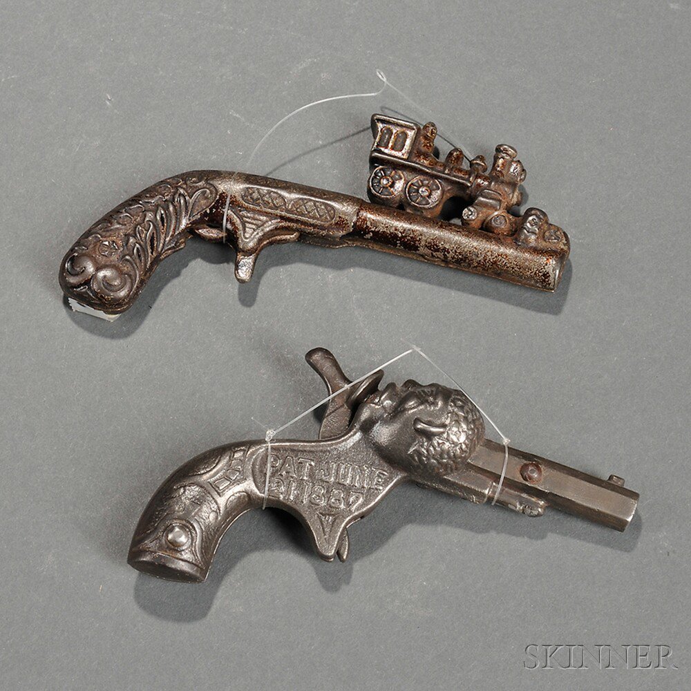 Appraisal: Two Cast Iron Toy Cap Guns America late th century