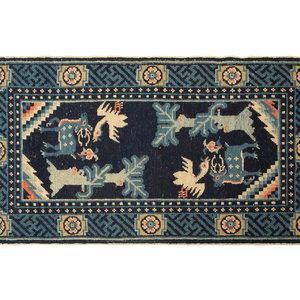 Appraisal: Two Chinese Wool Area Rugs th Century feet inches x