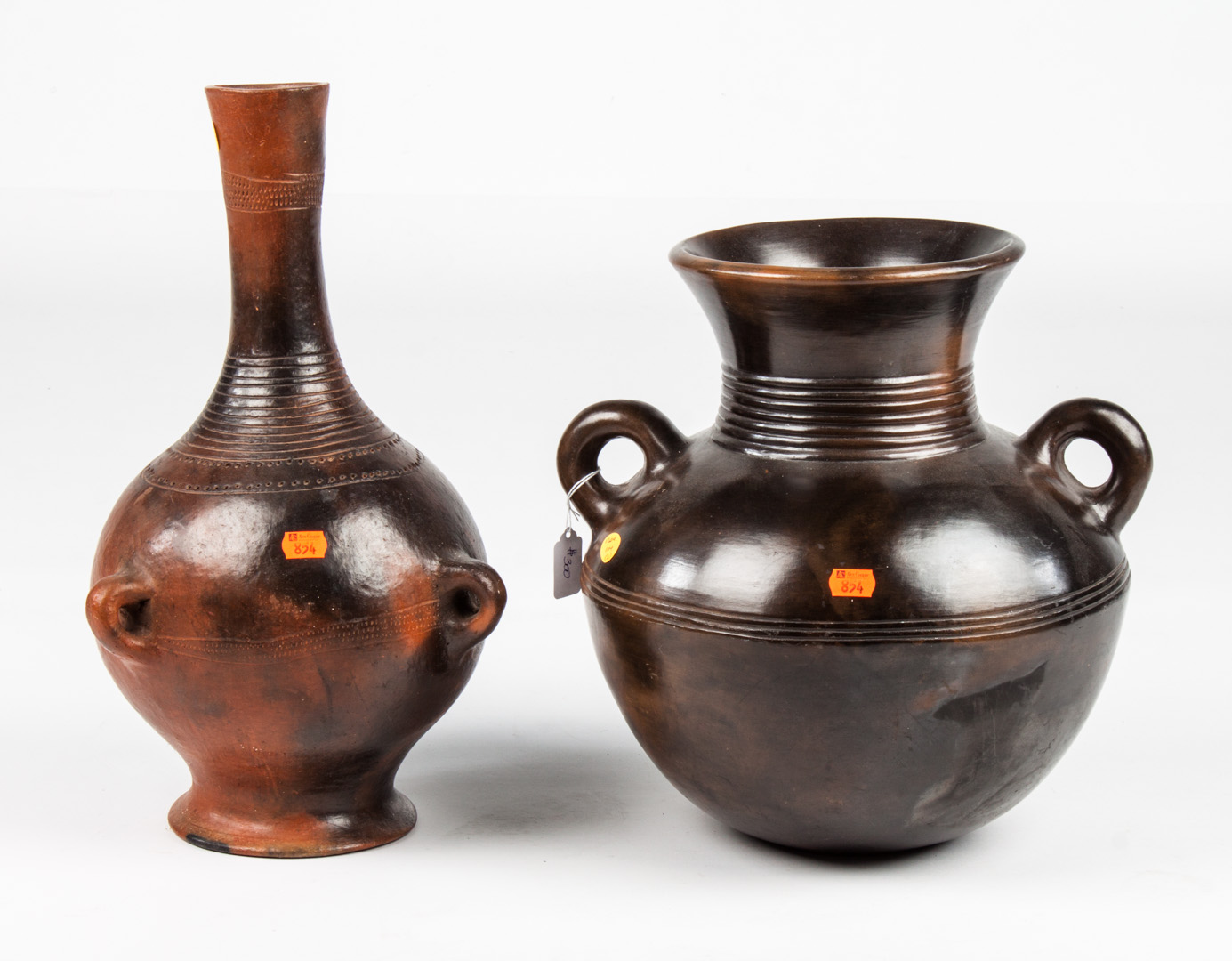 Appraisal: Two burnished earthenware vases from Ethiopia