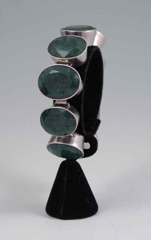 Appraisal: CT EMERALD BRACELET Sterling silver link bracelet contains nine oval