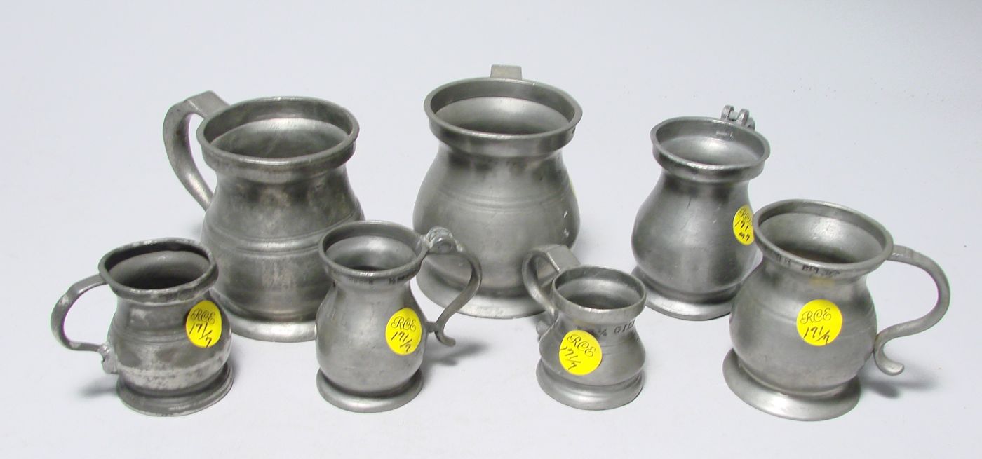 Appraisal: SEVEN ENGLISH BALUSTER-FORM PEWTER MEASURES th CenturyIn varying heights Not