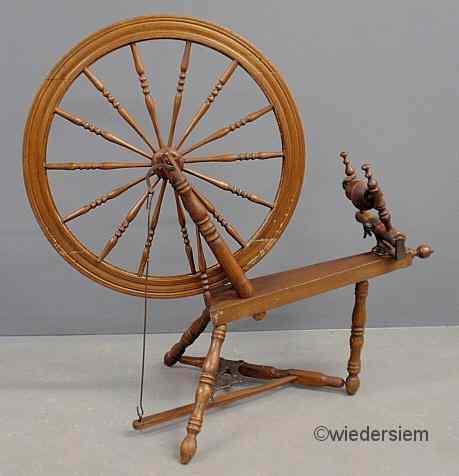 Appraisal: Maple and oak spinning wheel th c ''h x ''l