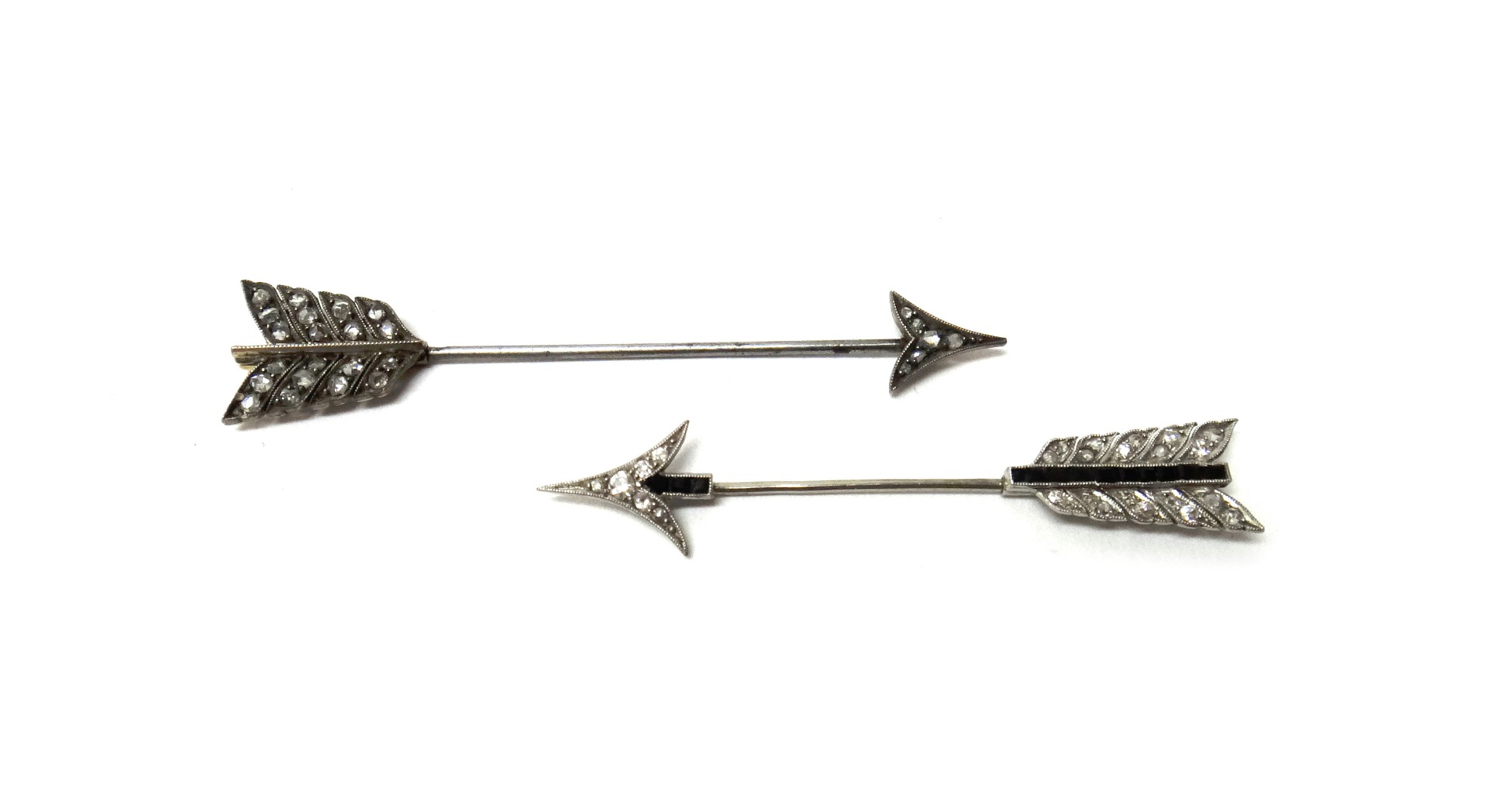 Appraisal: A diamond and black onyx set jabot pin designed as