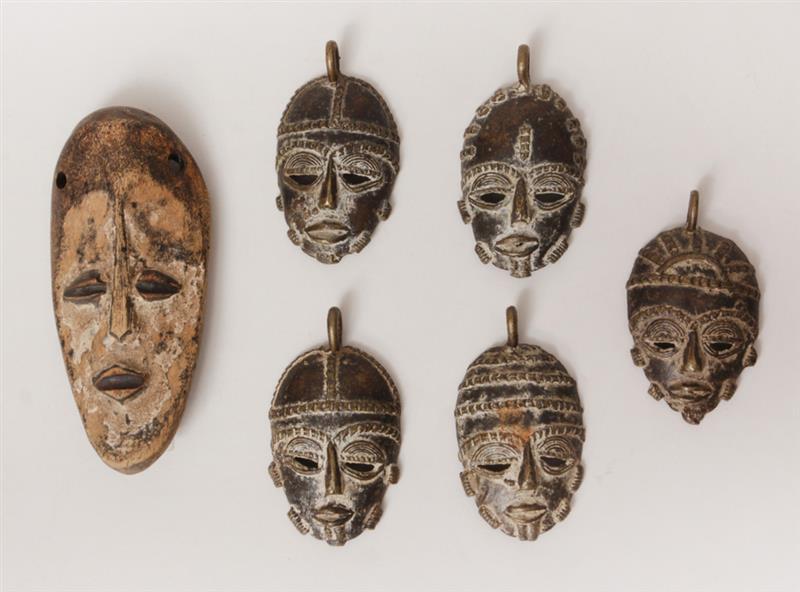 Appraisal: Five African Brass Miniature Face Mask Pendants and a Lugea