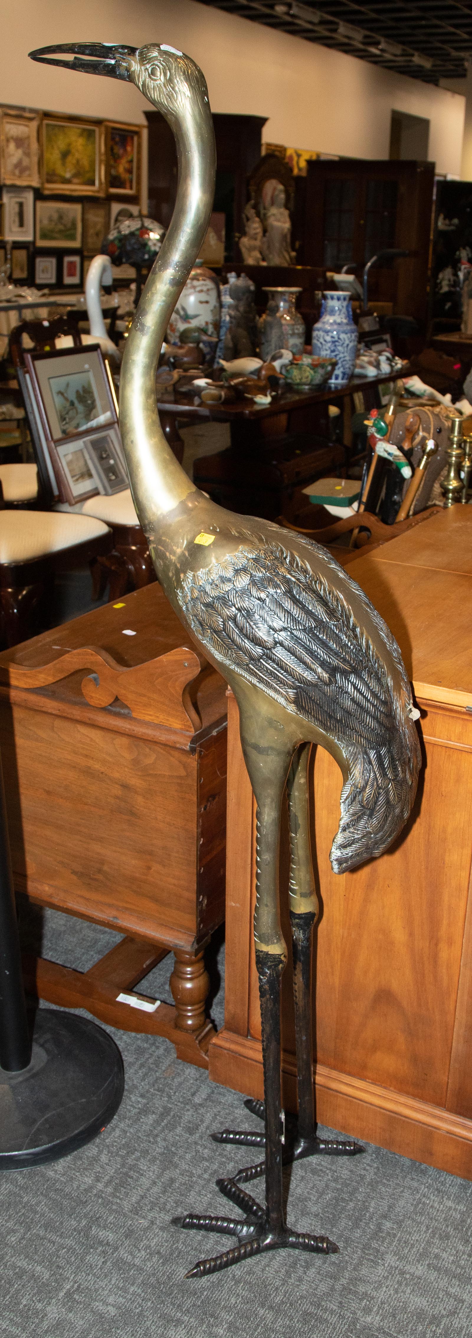 Appraisal: POLISHED BRONZE FIGURE OF A HERON Modern in H