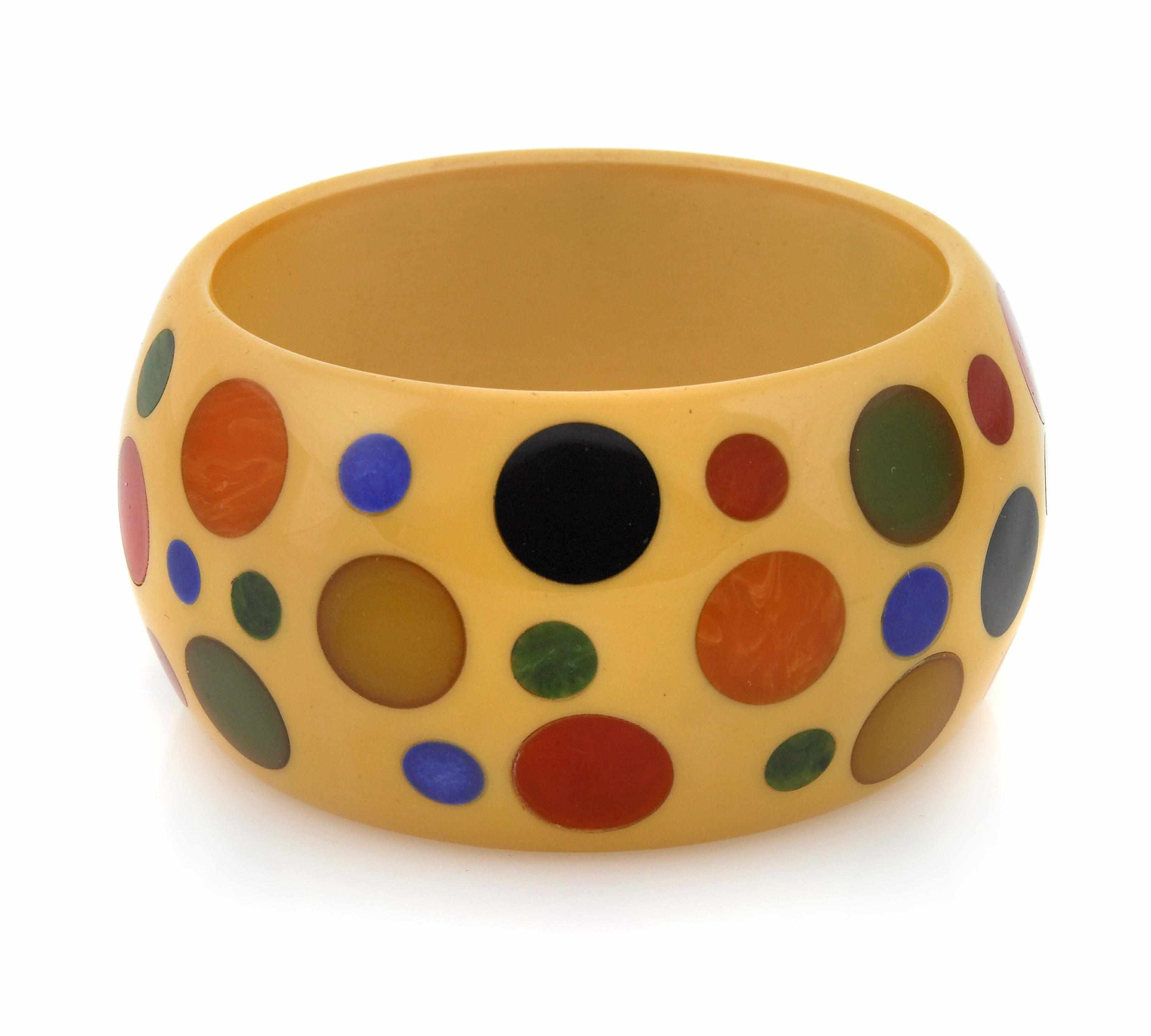 Appraisal: A Bakelite ''dot'' bangle bracelet Schultz each diameter in