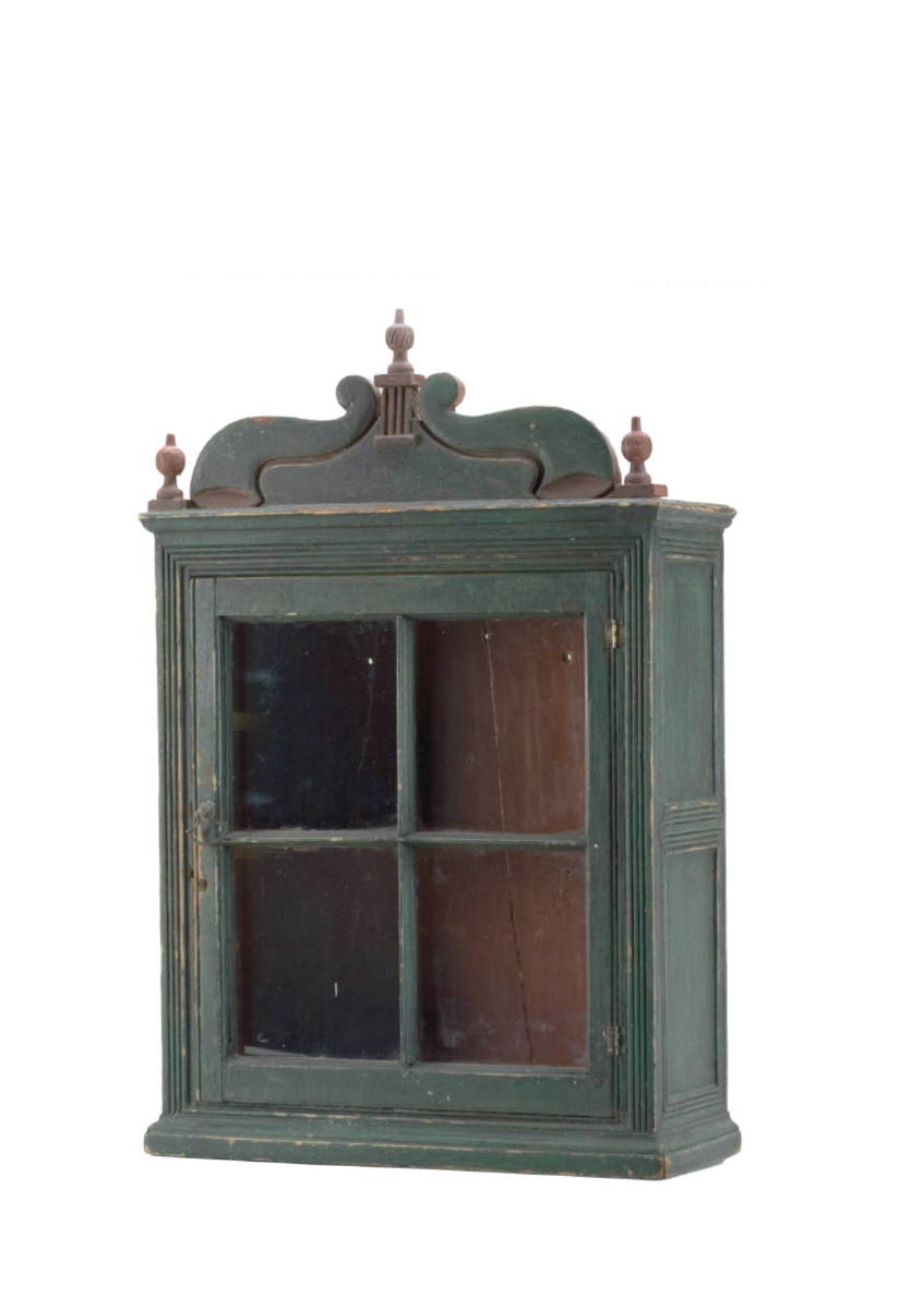 Appraisal: PENNSYLVANIA CARVED AND PAINTED HANGING CUPBOARD The scrolled crest with