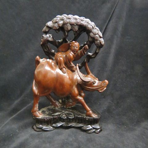 Appraisal: Chinese Carved Wooden Figures ofboy riding on a water buffalo