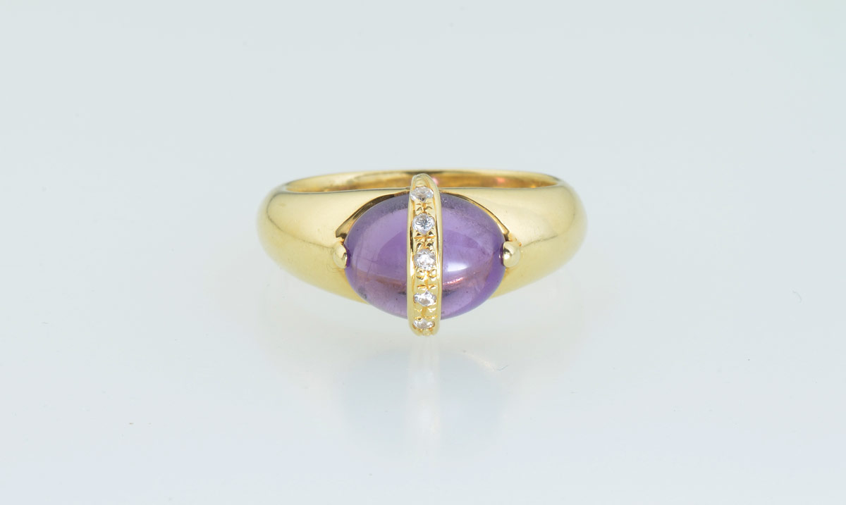 Appraisal: K DIAMOND AMETHYST FASHION RING K yellow gold ring contains