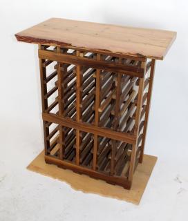 Appraisal: Wine rack with naturalistic top and base Wine rack with