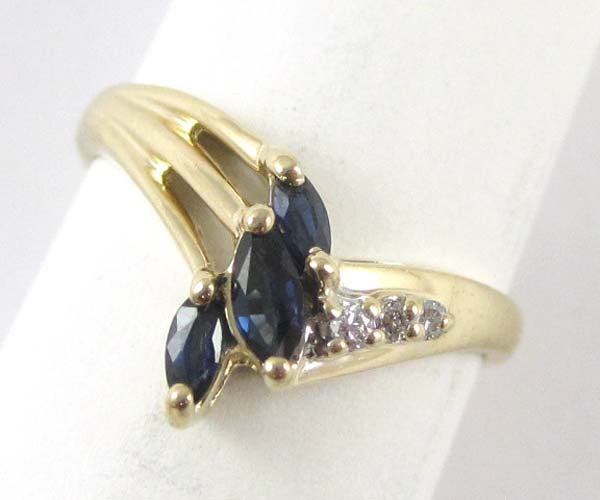 Appraisal: SAPPHIRE DIAMOND AND FOURTEEN KARAT GOLD RING set with three