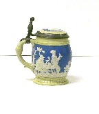 Appraisal: Mettlach liter stein relief vignette of men bowling with keg