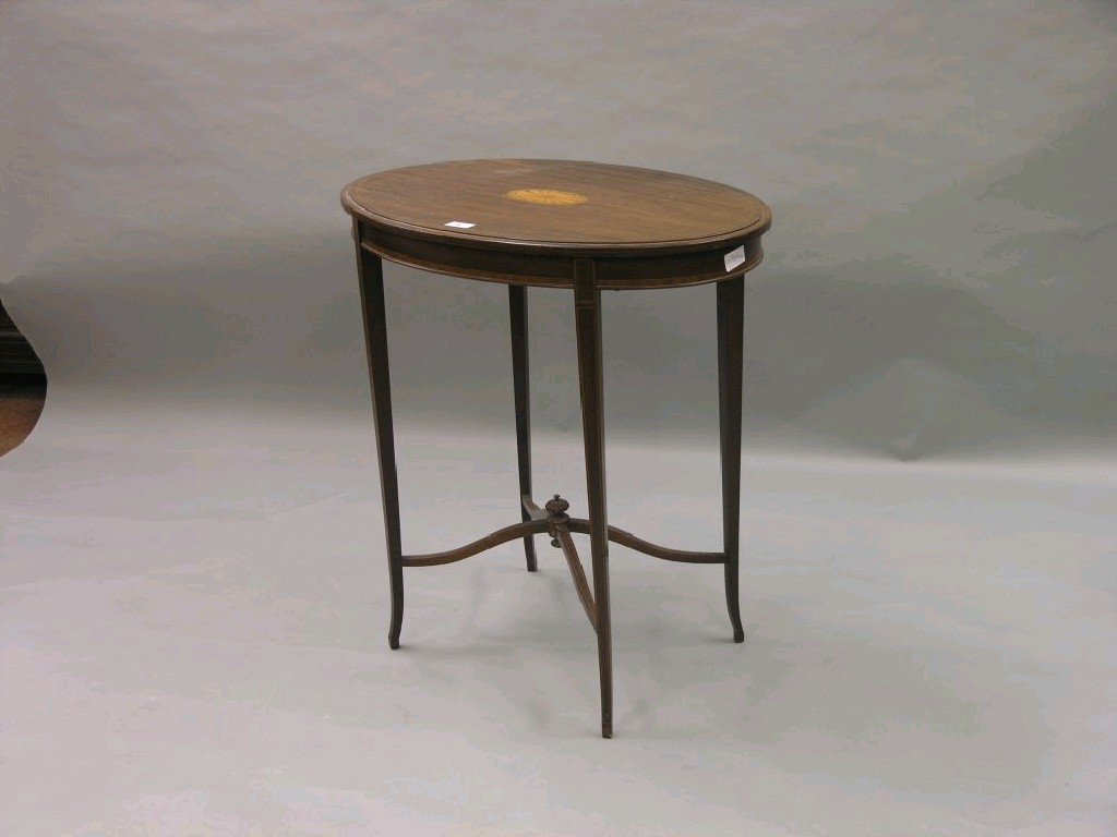 Appraisal: An Edwardian inlaid mahogany occasional table oval shape the top