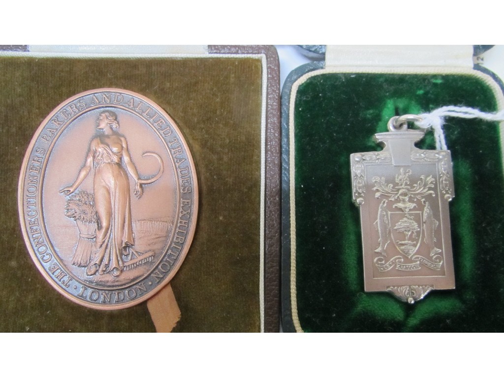 Appraisal: Lot comprising silver baker's trade award and bronzed metal similar