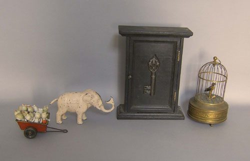 Appraisal: Group of miniature bisque dolls together with an elephant bank