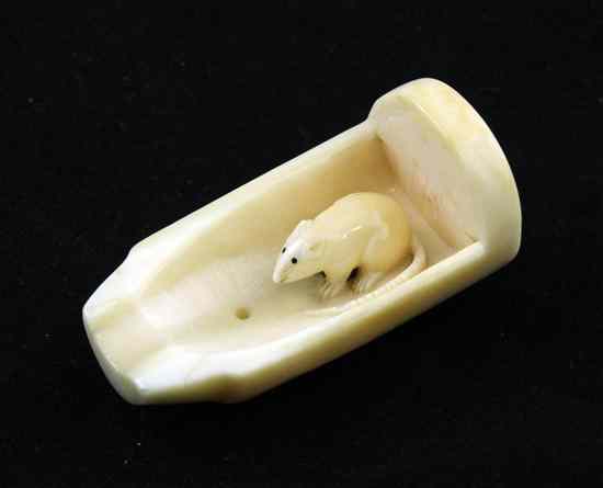 Appraisal: An ivory ingio or seal-netsuke carved as a rat in