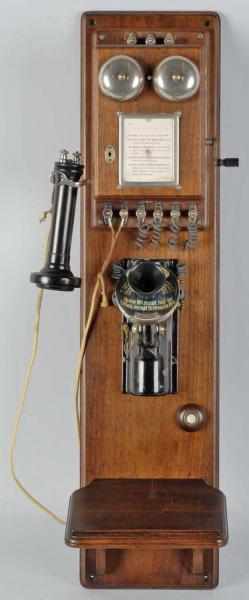 Appraisal: Western Electric Common Battery Wall Set Description Circa Walnut just