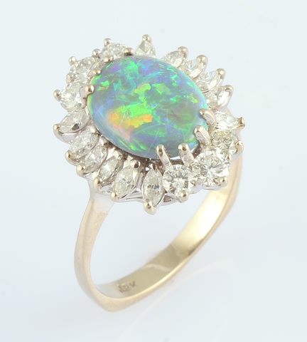 Appraisal: TT X mm oval black opal shows some crazing and