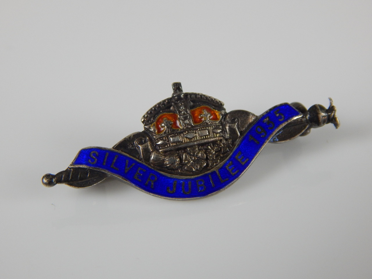 Appraisal: A silver 'Silver Jubilee ' bar brooch with blue and