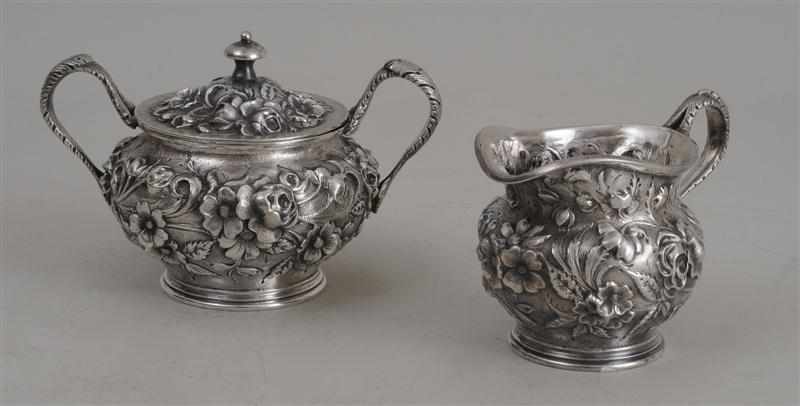 Appraisal: JACOBI CO REPOUSS SILVER CREAMER AND COVERED SUGAR BOWL Each