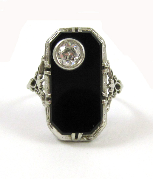 Appraisal: DIAMOND BLACK ONYX AND EIGHTEEN KARAT GOLD RING The white