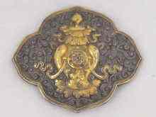 Appraisal: An Eastern possibly Tibetan belt buckle of lobed shape the