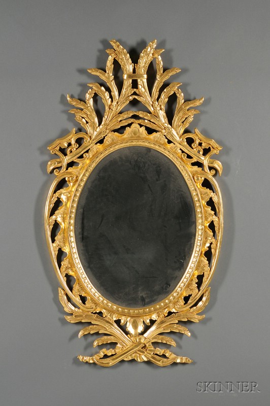 Appraisal: Rococo Style Oval Giltwood Mirror th century frame with openwork