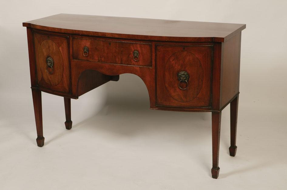 Appraisal: A GEORGE III STYLE MAHOGANY BOW FRONT SIDEBOARD the shaped