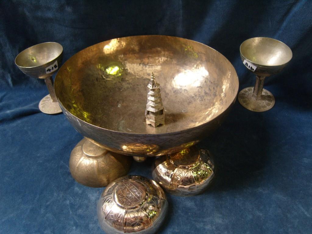 Appraisal: An eastern white metal bowl with stylised decoration together with