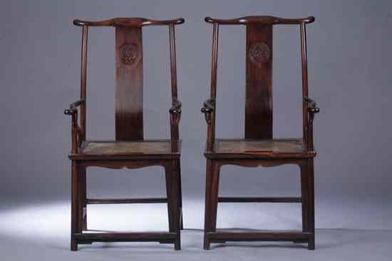 Appraisal: PAIR CHINESE ROSEWOOD OFFICIAL'S HAT ARM CHAIRS th century The