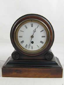 Appraisal: A mahogany and ebonised mantel clock with day pendulum movement