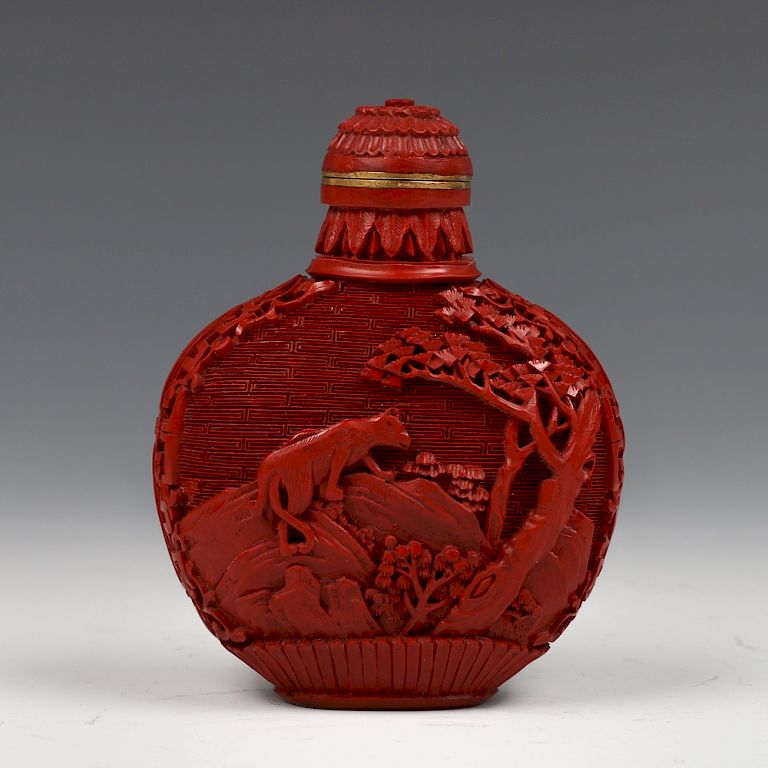 Appraisal: CHINESE CARVED CINNABAR LACQUER SNUFF BOTTLE Of a flattened globular