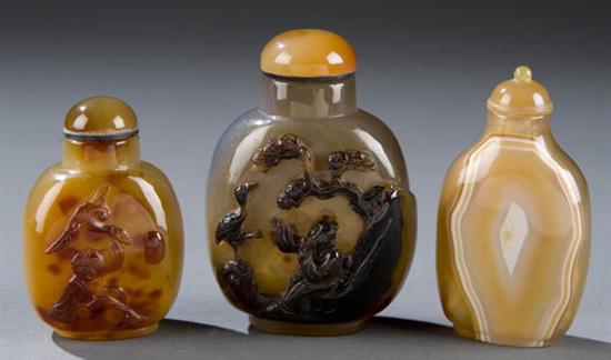 Appraisal: Group of three Chinese agate snuff bottles Smoke colored bottle