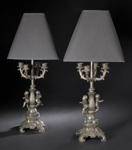 Appraisal: Large Pair of French Bronze-Patinated and Parcel-Gilt Spelter Candelabrum Table