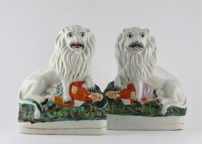 Appraisal: A pair of Staffordshire models of the British lion victorious