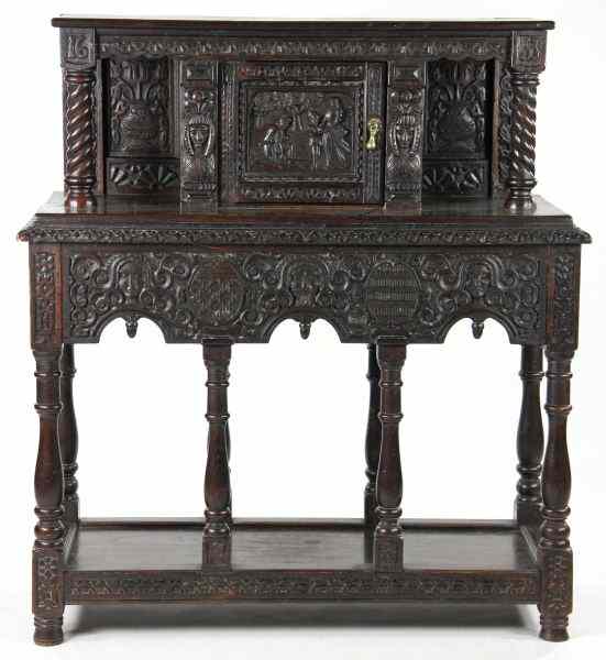 Appraisal: Jacobean Style Court Cupboardexuberantly carved throughout with masks and flowers