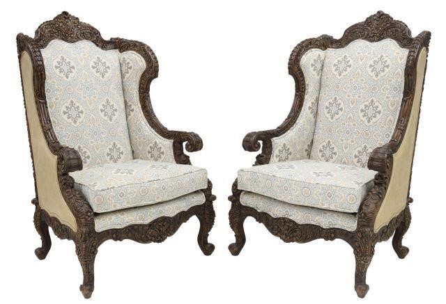 Appraisal: pair Baroque style wingback armchairs th c having walnut finish