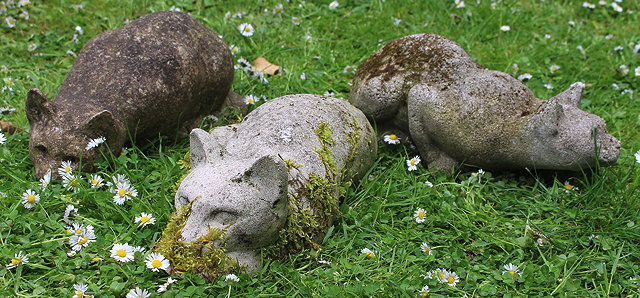 Appraisal: THREE WEATHERED MOSSY CAST COMPOSITE STONE FIGURES OF CATS cm