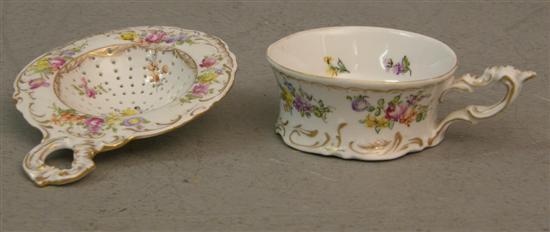 Appraisal: Dresden porcelain strainer and a matching cup h w in