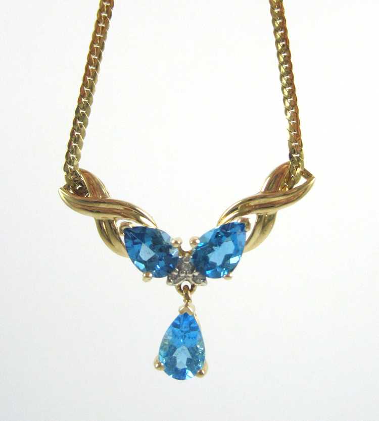 Appraisal: BLUE TOPAZ AND FOURTEEN KARAT GOLD NECKLACE measuring inches in