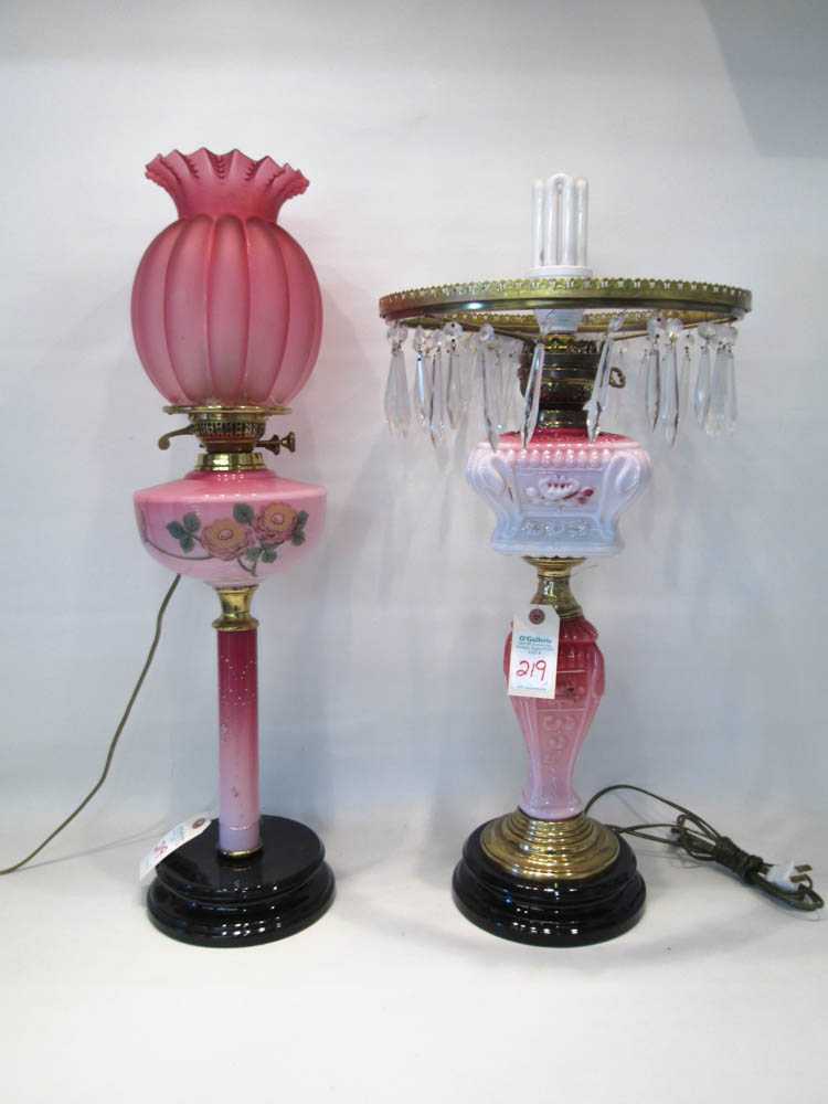 Appraisal: TWO ELECTRIFIED VICTORIAN GLASS TABLE LAMPS the first with a